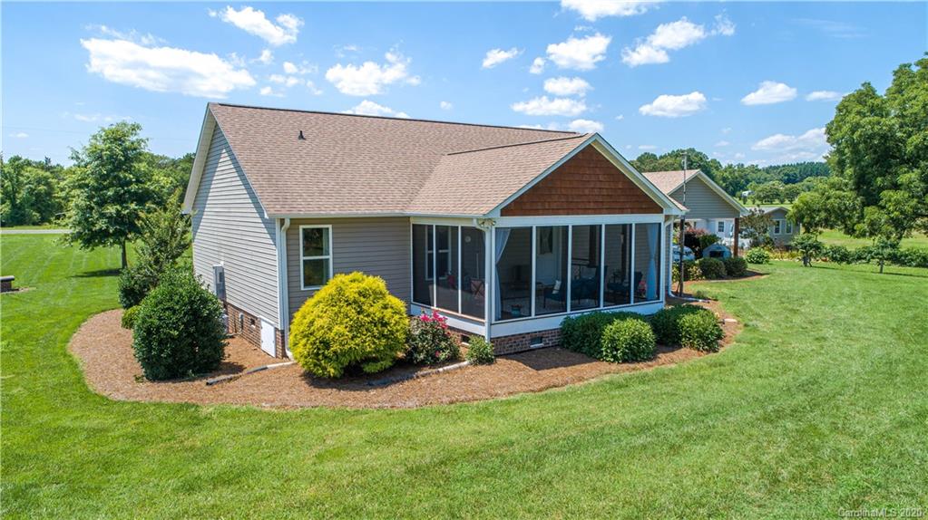 24376 Endy Road Albemarle, NC 28001 - Photo 4 of 27 a front view of a house with garden