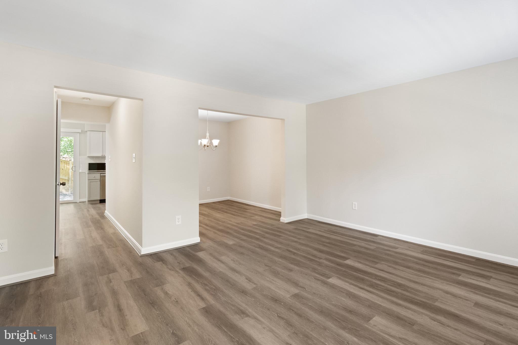 8581 Chester Grove Court Springfield, VA 22153 - Photo 2 of 38 a view of wooden floor and windows in a room