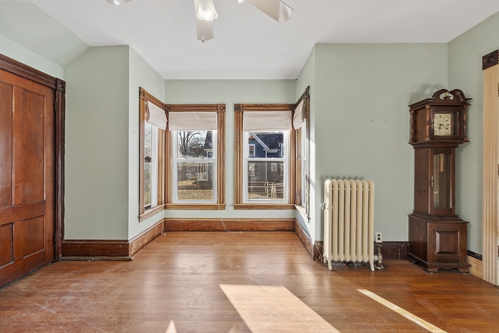 39 Terrace Street Orange, MA 01364 - Photo 11 of 40 a view of a livingroom with wooden floor and staircase