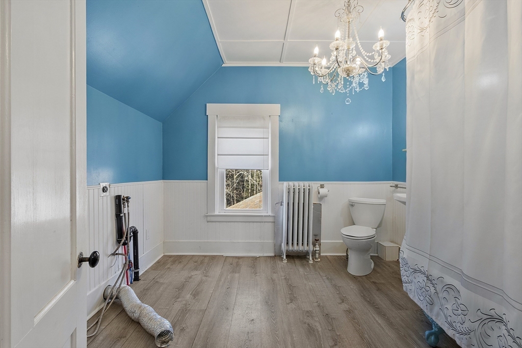 39 Terrace Street Orange, MA 01364 - Photo 17 of 40 a bathroom with a toilet a sink and mirror