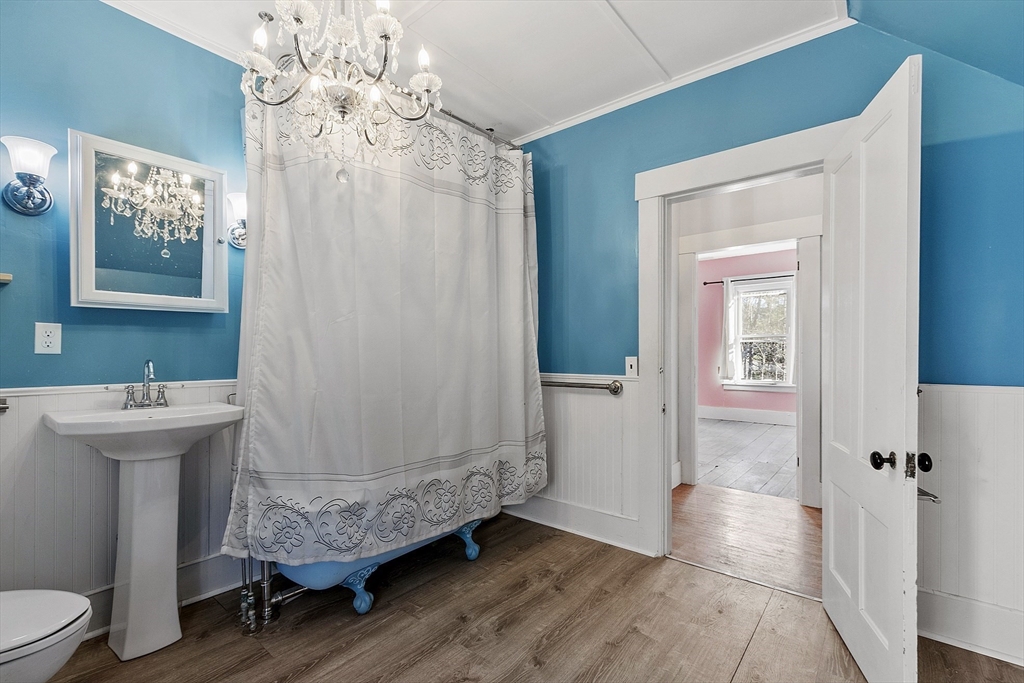 39 Terrace Street Orange, MA 01364 - Photo 18 of 40 a bathroom with a sink mirror and toilet