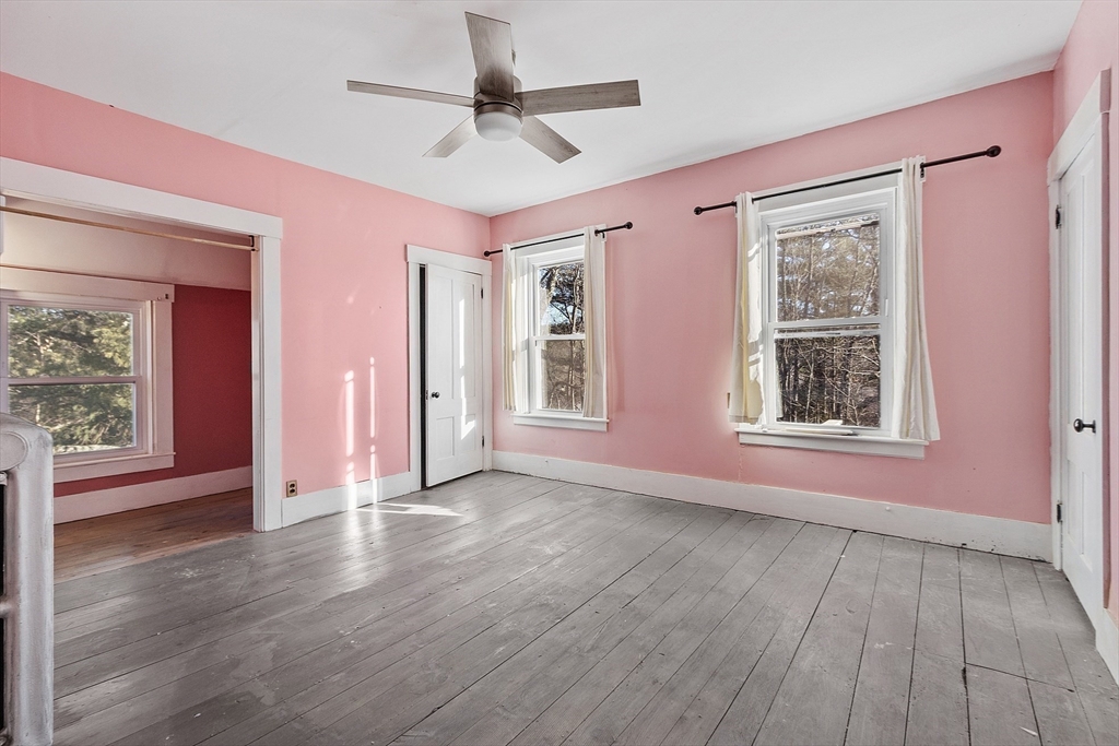 39 Terrace Street Orange, MA 01364 - Photo 23 of 40 a view of an empty room with window and wooden floor