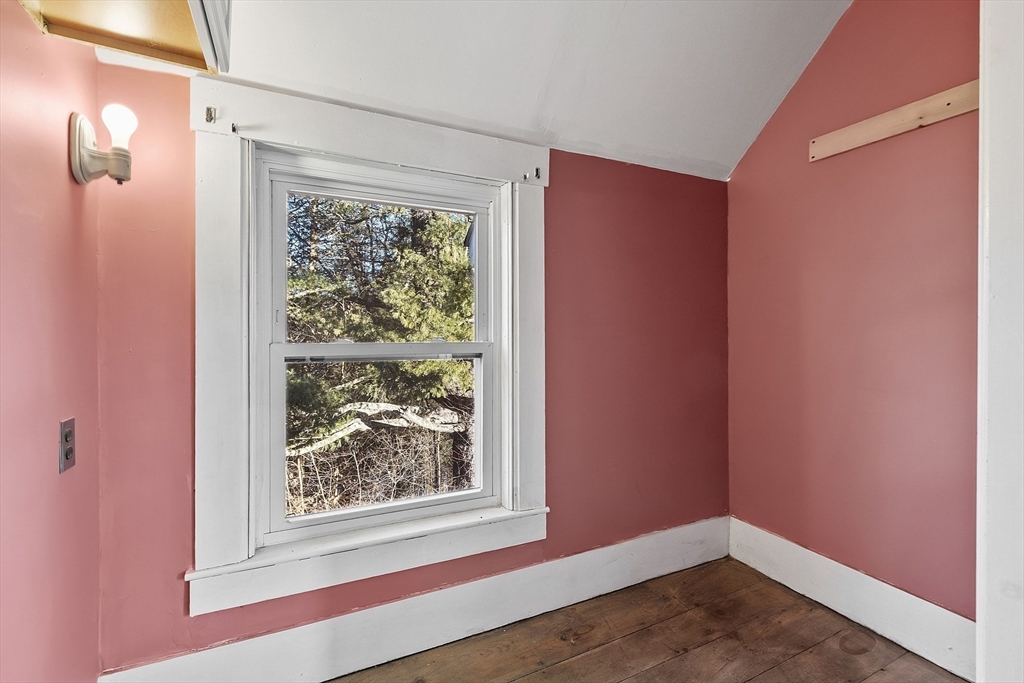 39 Terrace Street Orange, MA 01364 - Photo 25 of 40 an empty room with wooden floor and a window