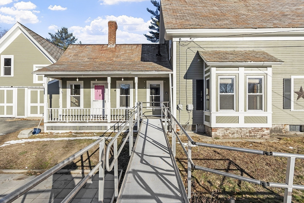 39 Terrace Street Orange, MA 01364 - Photo 35 of 40 a view of a house with wooden deck and furniture