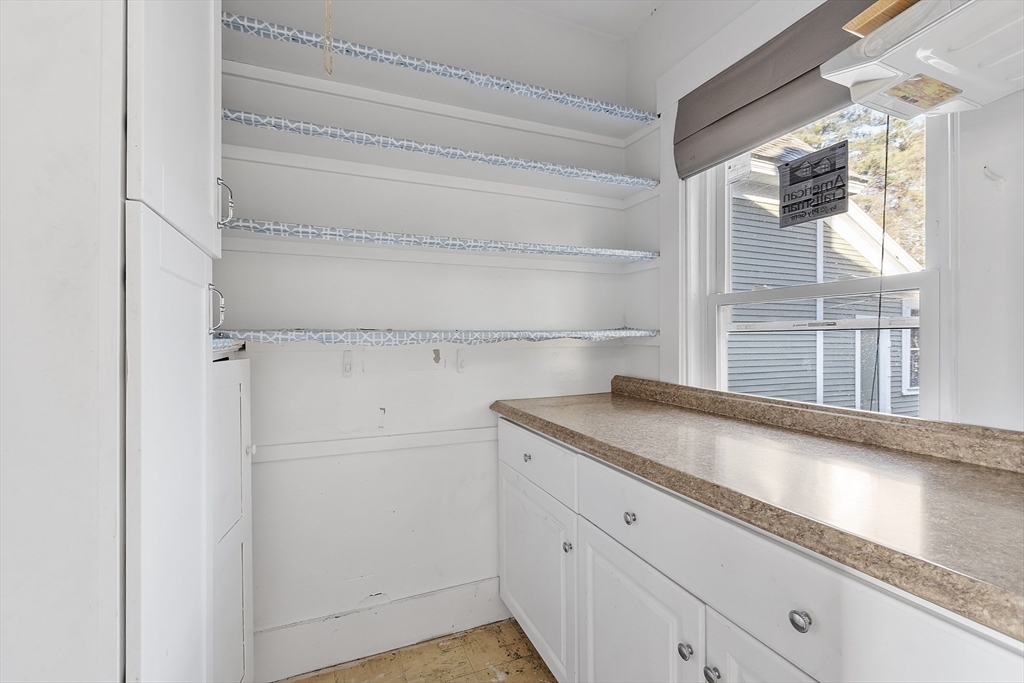 39 Terrace Street Orange, MA 01364 - Photo 9 of 40 a view of cabinets and window