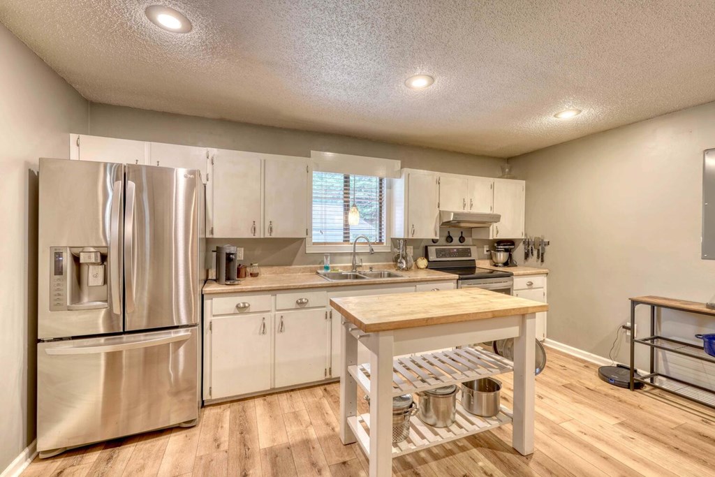 14 Priscilla Lane Murphy, NC 28906 - Photo 11 of 42 a kitchen with a refrigerator a stove a sink and a chairs