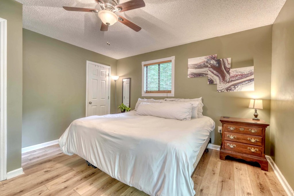 14 Priscilla Lane Murphy, NC 28906 - Photo 14 of 42 a bedroom with a bed and a chandelier
