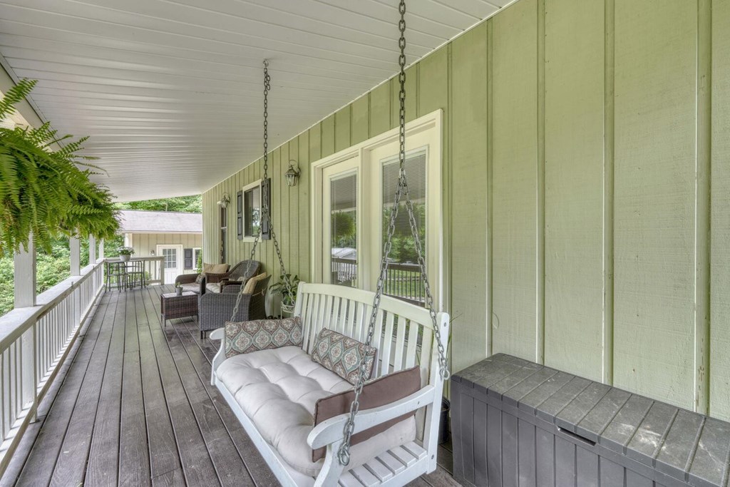 14 Priscilla Lane Murphy, NC 28906 - Photo 21 of 42 a balcony with furniture and wooden floor