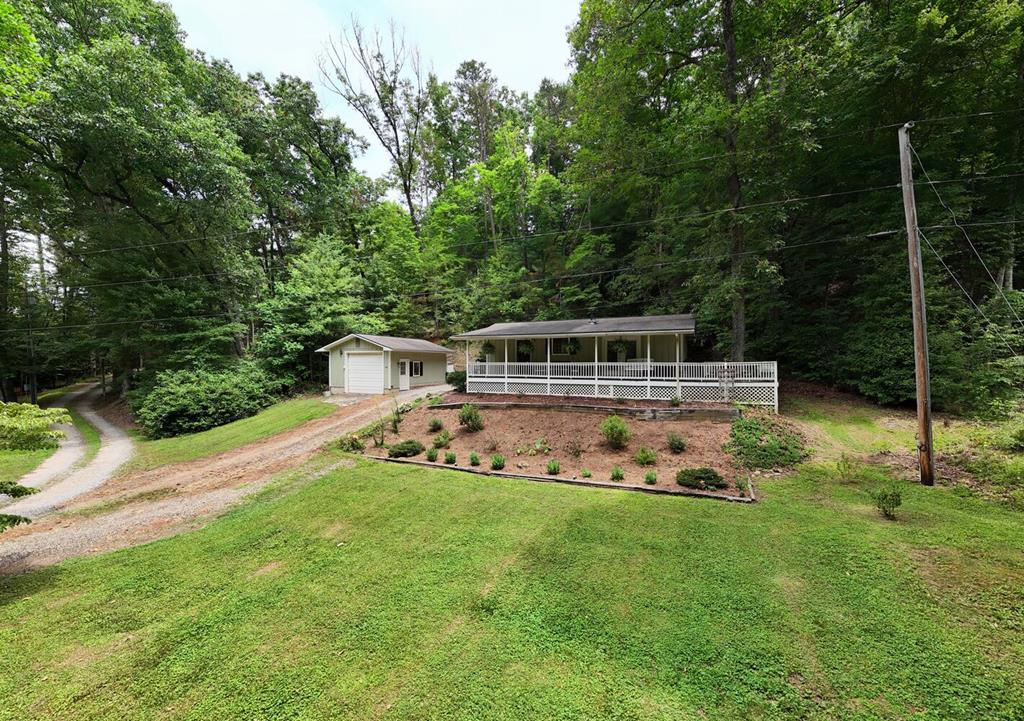 14 Priscilla Lane Murphy, NC 28906 - Photo 4 of 42 a view of a house with backyard sitting area and garden