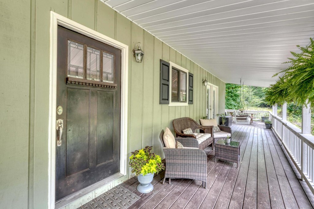 14 Priscilla Lane Murphy, NC 28906 - Photo 6 of 42 a balcony with furniture and wooden floor