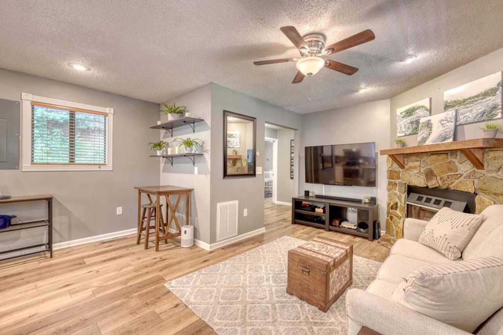 14 Priscilla Lane Murphy, NC 28906 - Photo 7 of 42 a living room with furniture a flat screen tv and a window