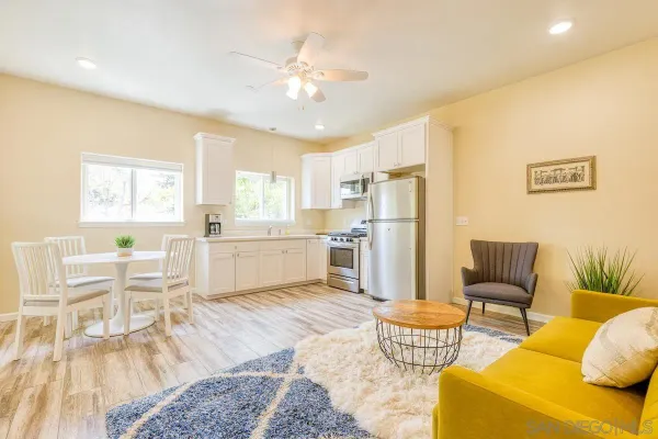 a living room with furniture and a table