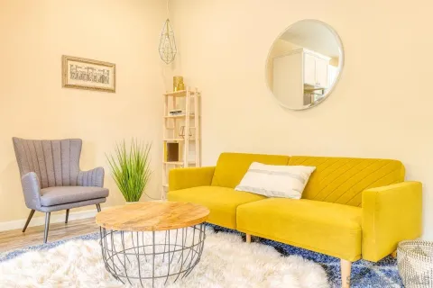 a living room with a couch and a table