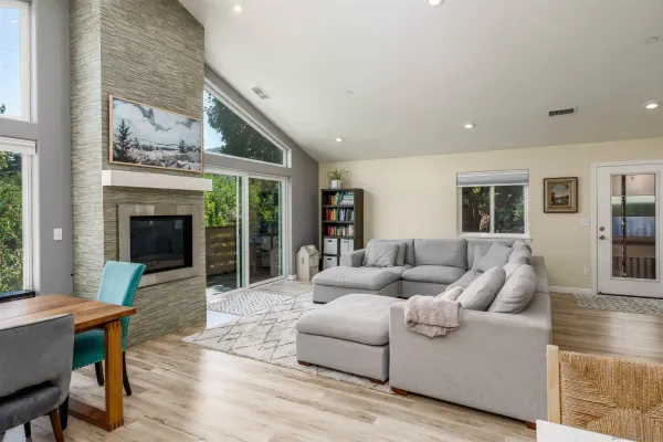 a living room with furniture and a fireplace
