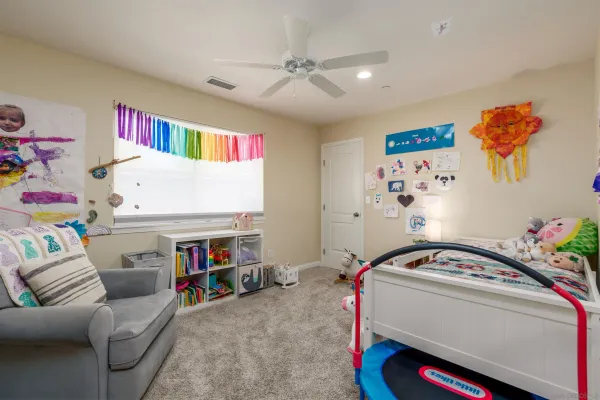 a bedroom with furniture and a chandelier