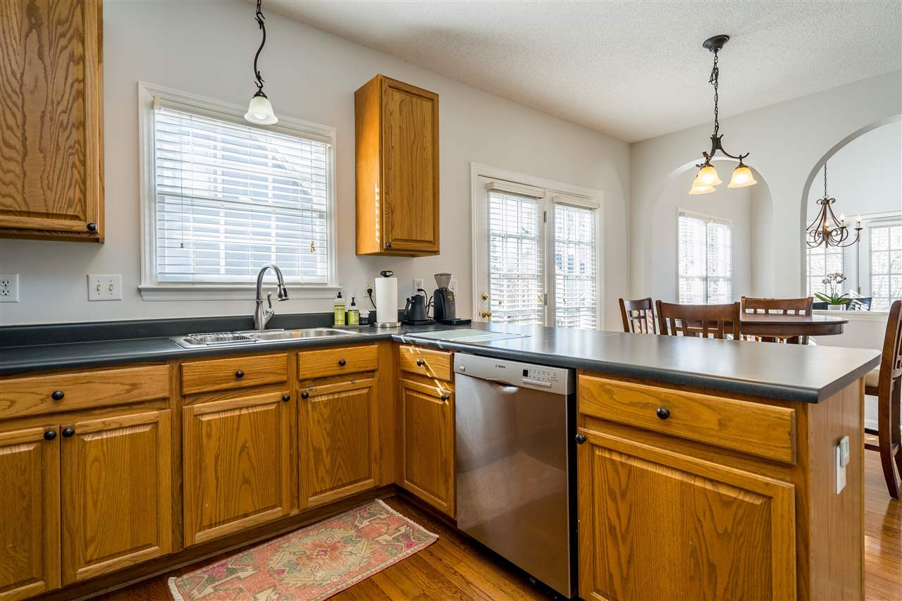 5221 Denmead Way Raleigh, NC 27613 - Photo 14 of 28 Clean kitchen with stainless steel appliances and open concept! Kitchen