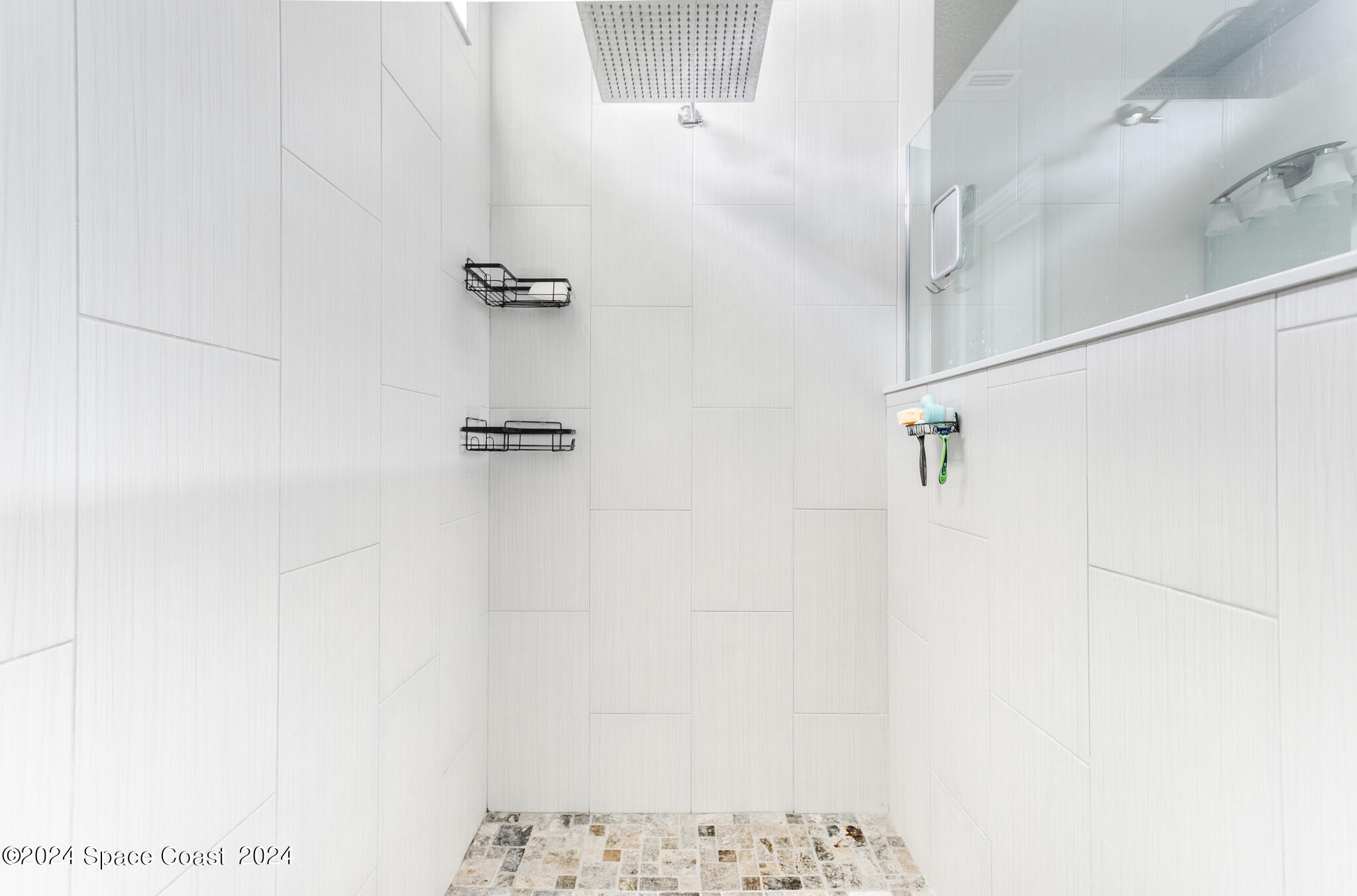 865 Hawks Ridge Court Northeast Palm Bay, FL 32905 - Photo 17 of 47 a bathroom with a shower
