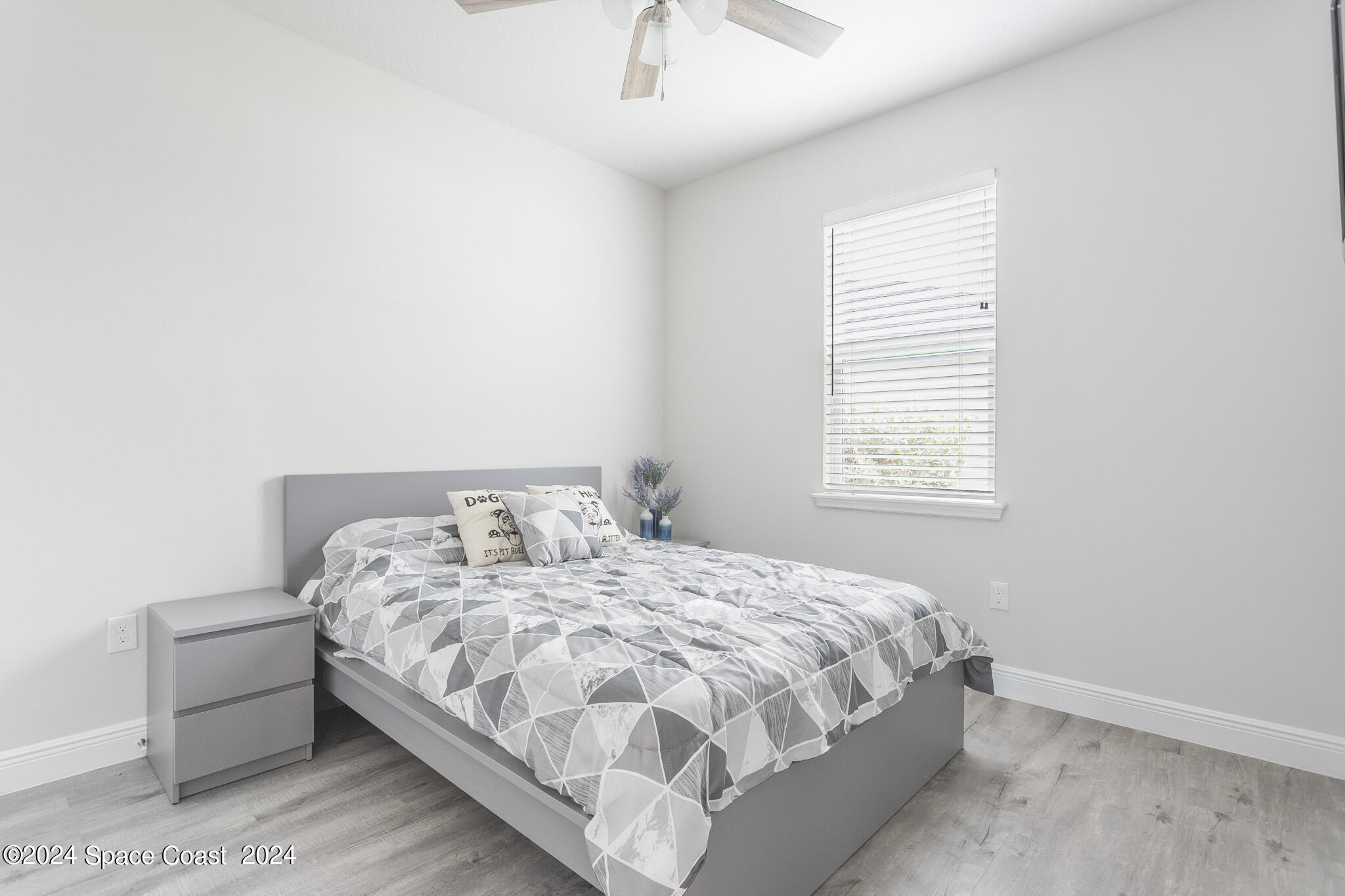 865 Hawks Ridge Court Northeast Palm Bay, FL 32905 - Photo 22 of 47 a bedroom with a bed and a window