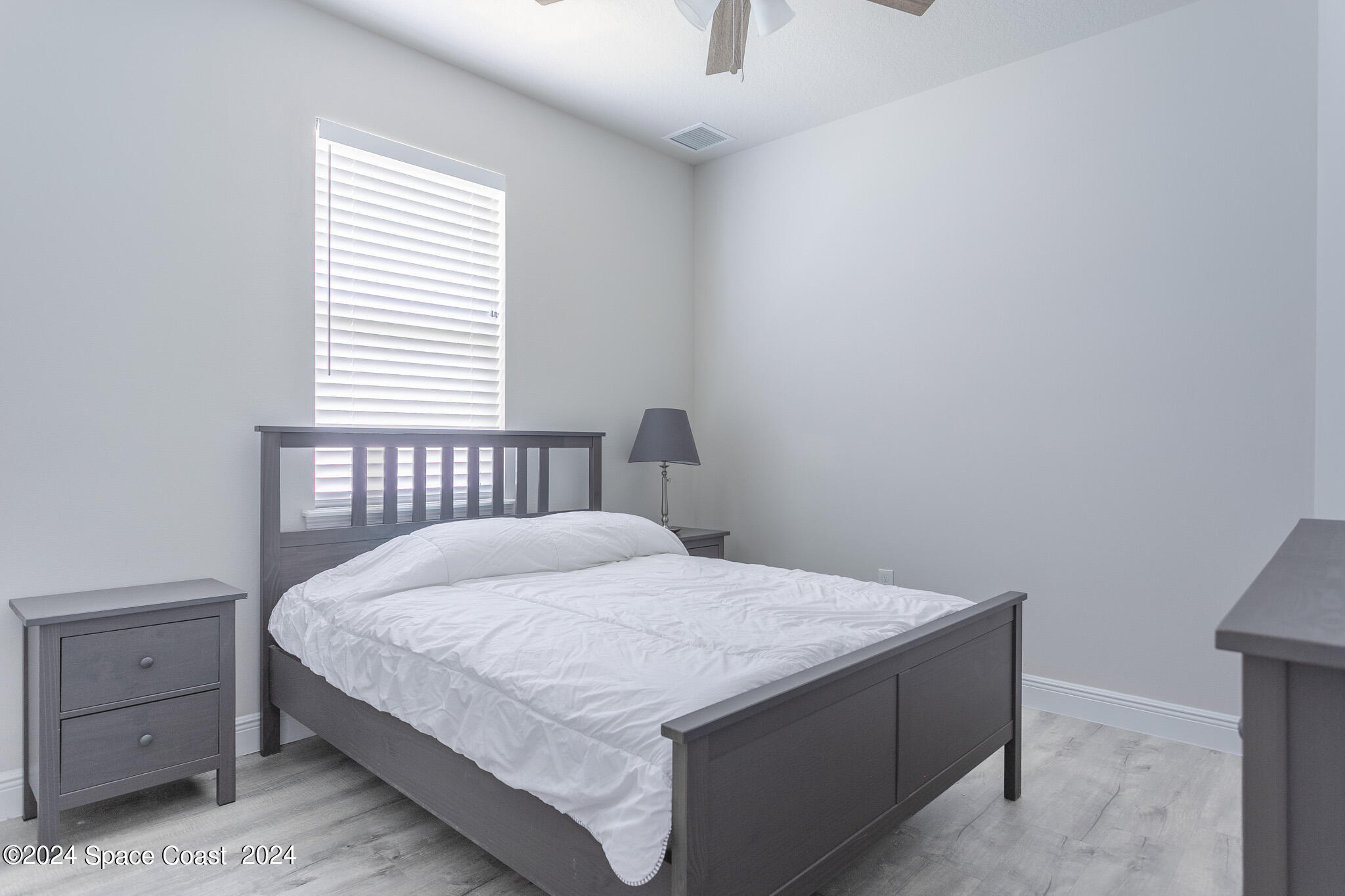 865 Hawks Ridge Court Northeast Palm Bay, FL 32905 - Photo 23 of 47 a bedroom with a bed and window