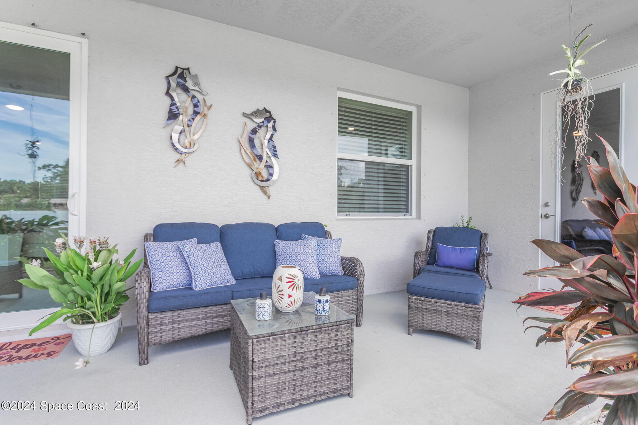 865 Hawks Ridge Court Northeast Palm Bay, FL 32905 - Photo 26 of 47 a living room with furniture a couch and a window