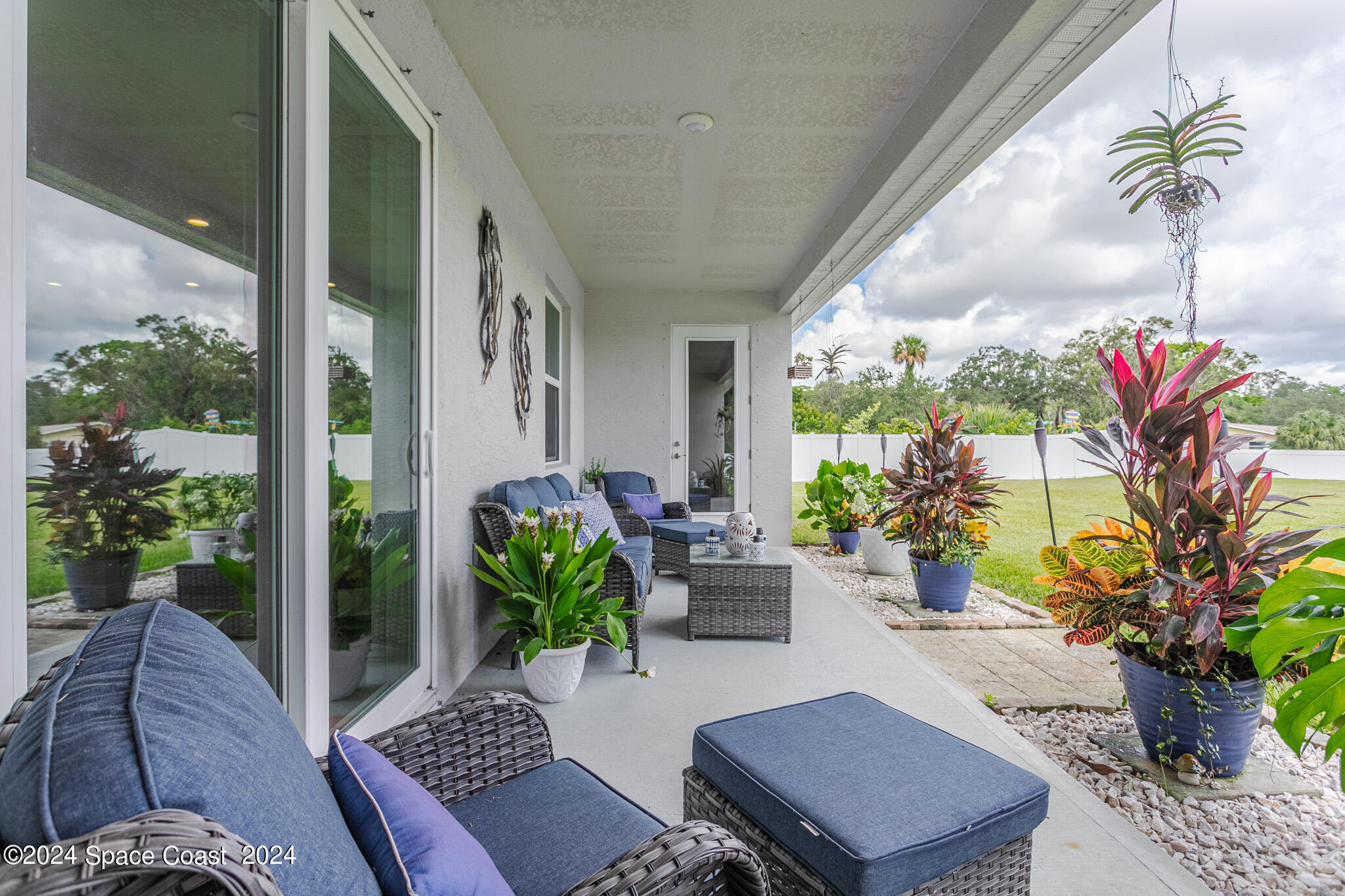 865 Hawks Ridge Court Northeast Palm Bay, FL 32905 - Photo 28 of 47 a outdoor living space with furniture