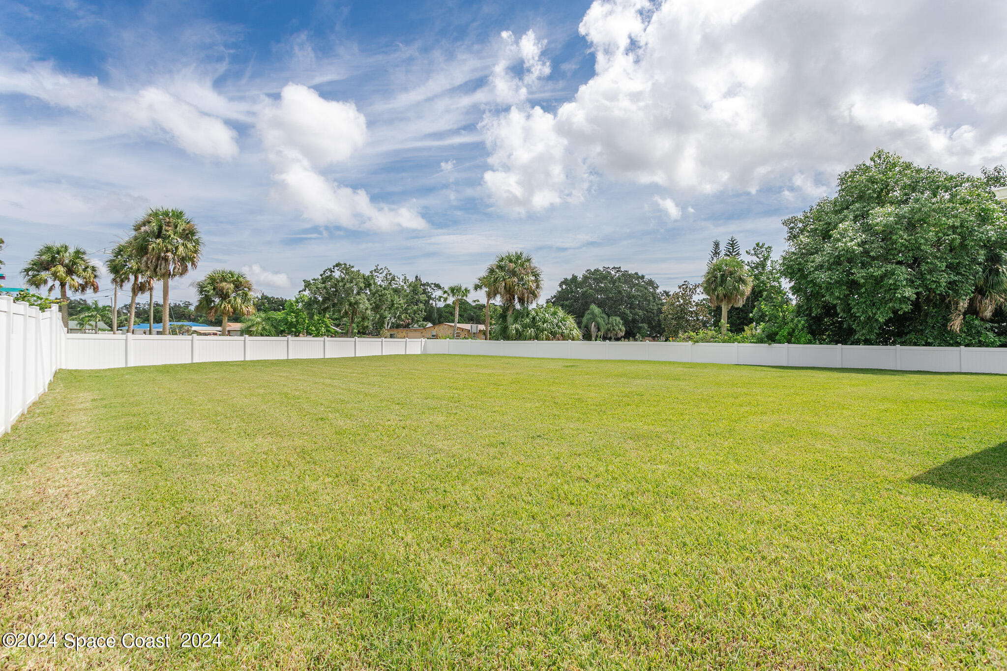 865 Hawks Ridge Court Northeast Palm Bay, FL 32905 - Photo 32 of 47 a view of a swimming pool and an outdoor space