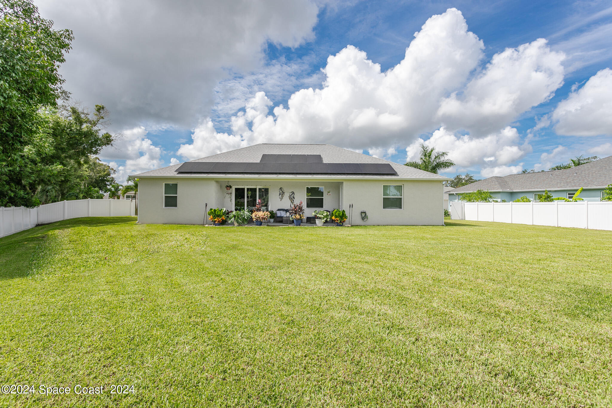 865 Hawks Ridge Court Northeast Palm Bay, FL 32905 - Photo 33 of 47 a front view of house with yard and entertaining space