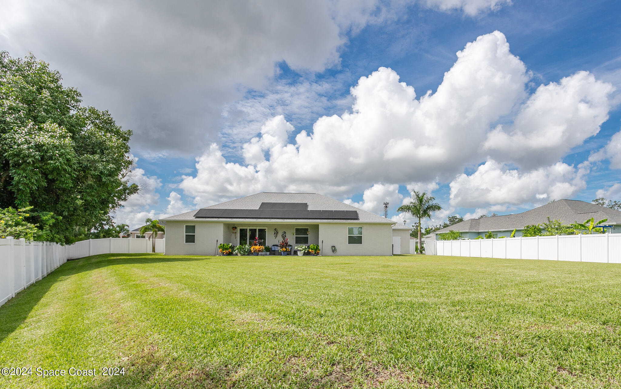 865 Hawks Ridge Court Northeast Palm Bay, FL 32905 - Photo 39 of 47 a front view of house with yard
