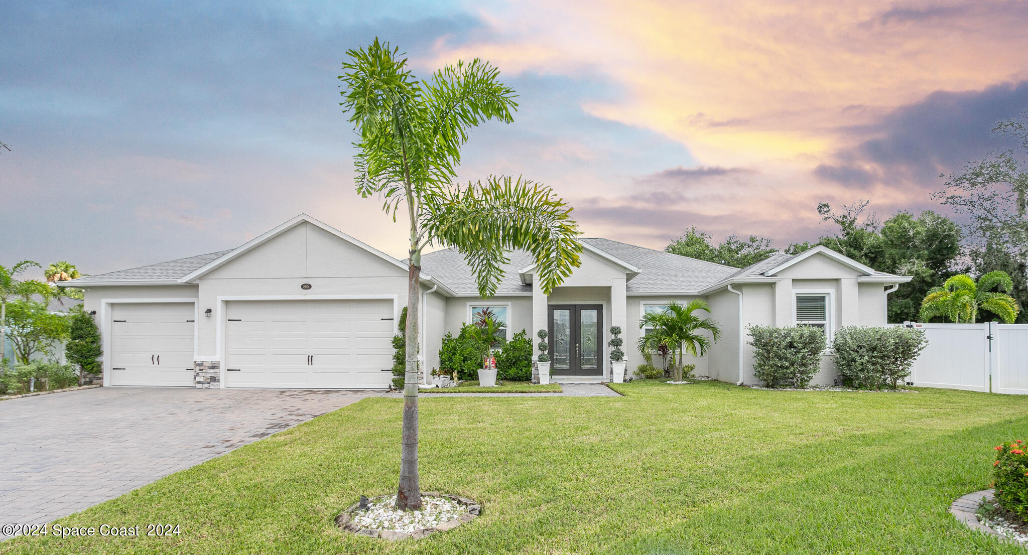 865 Hawks Ridge Court Northeast Palm Bay, FL 32905 - Photo 47 of 47 a front view of house with a garden and yard