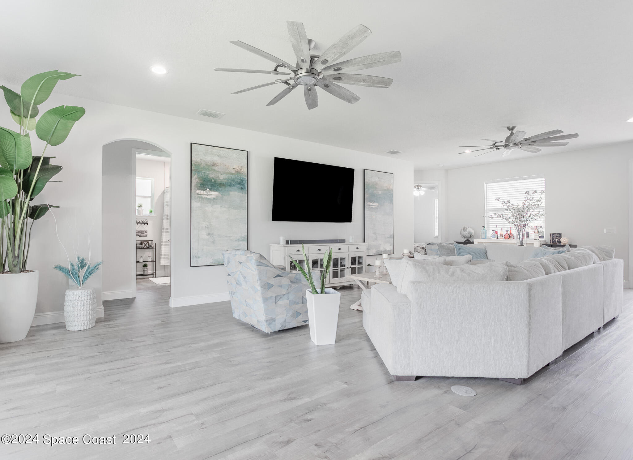 865 Hawks Ridge Court Northeast Palm Bay, FL 32905 - Photo 5 of 47 a living room with furniture and flat screen tv