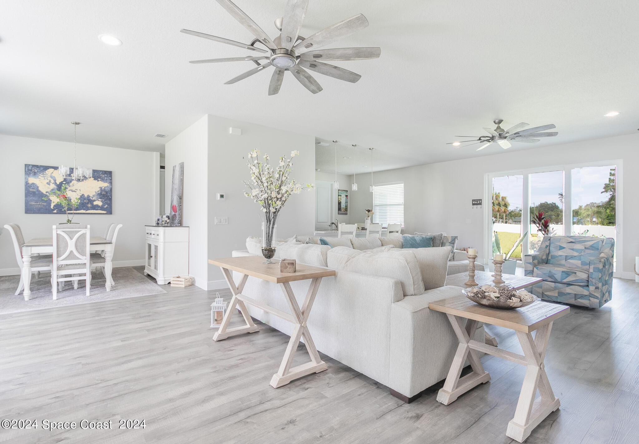 865 Hawks Ridge Court Northeast Palm Bay, FL 32905 - Photo 6 of 47 a living room with furniture and a large window
