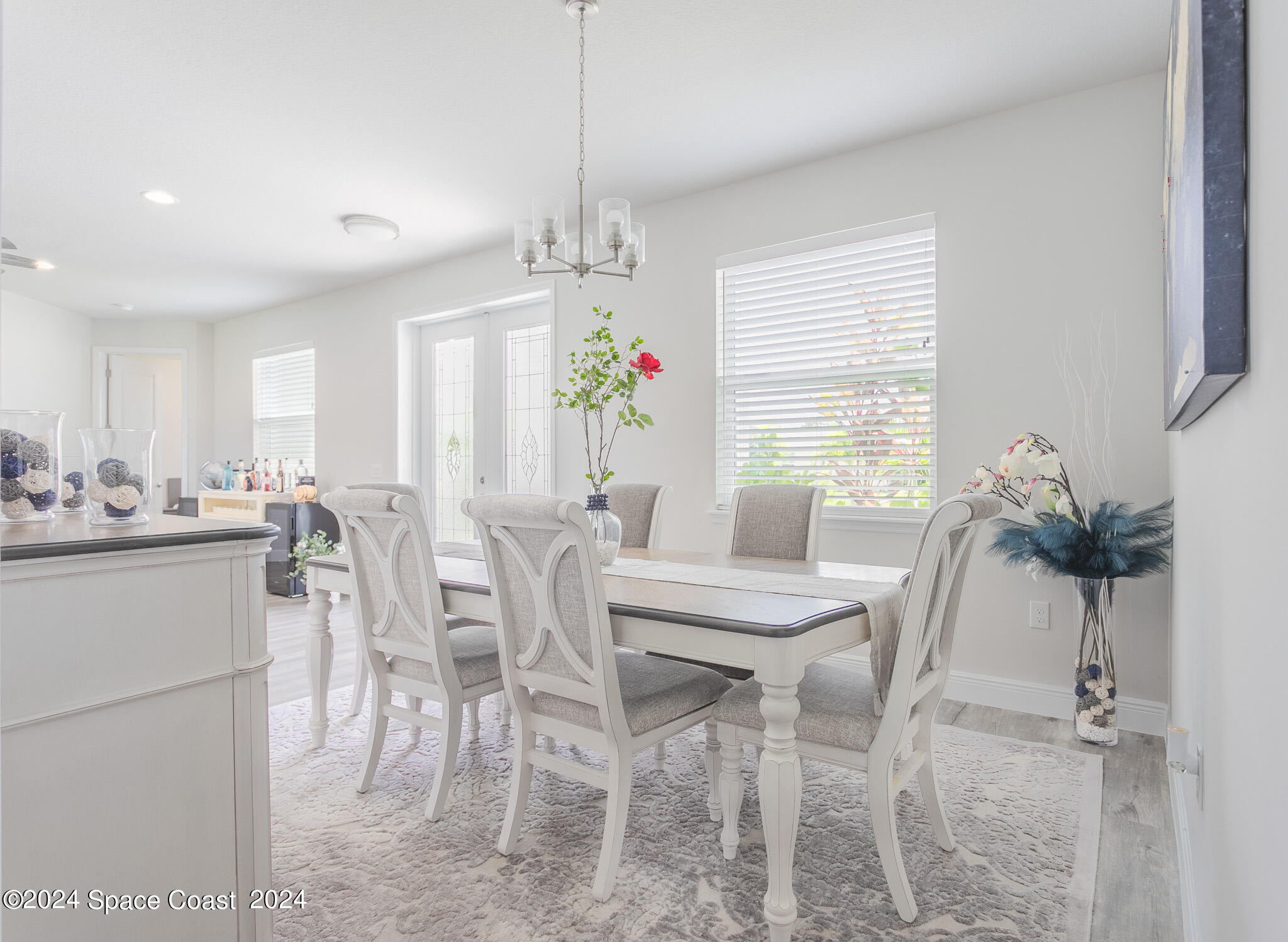 865 Hawks Ridge Court Northeast Palm Bay, FL 32905 - Photo 9 of 47 a view of a dining room with furniture and window