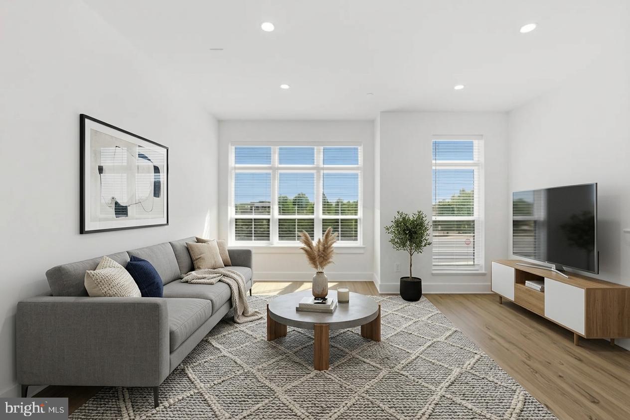 2018 Tysons Ridgeline Road Falls Church, VA 22043 - Photo 2 of 35 a living room with furniture a flat screen tv and a large window