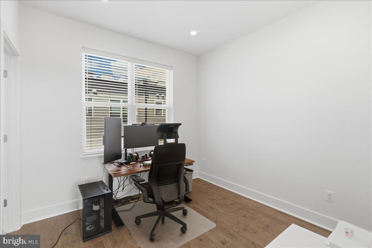 2018 Tysons Ridgeline Road Falls Church, VA 22043 - Photo 21 of 35 a view of a workspace with furniture and a window