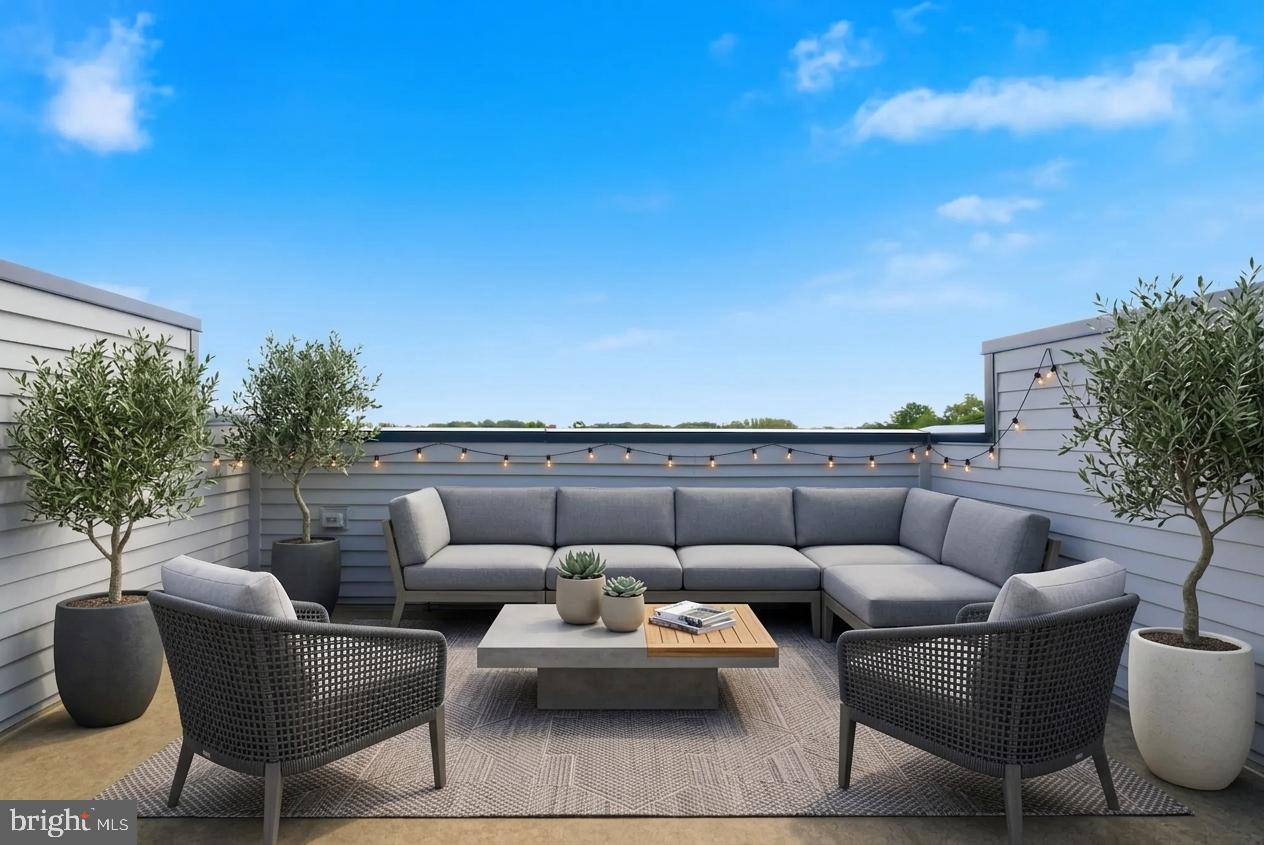 2018 Tysons Ridgeline Road Falls Church, VA 22043 - Photo 24 of 35 a roof deck with couches and potted plants