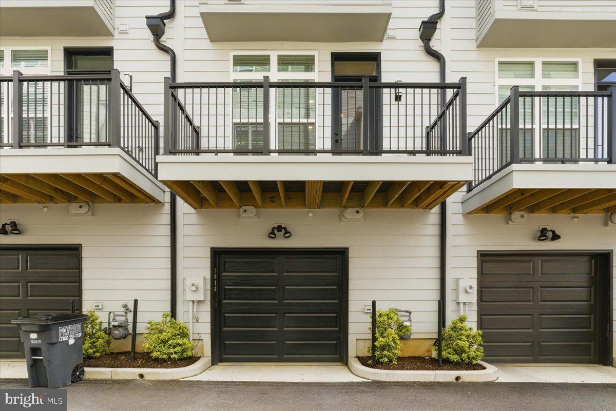 2018 Tysons Ridgeline Road Falls Church, VA 22043 - Photo 26 of 35 a front view of a house with garage