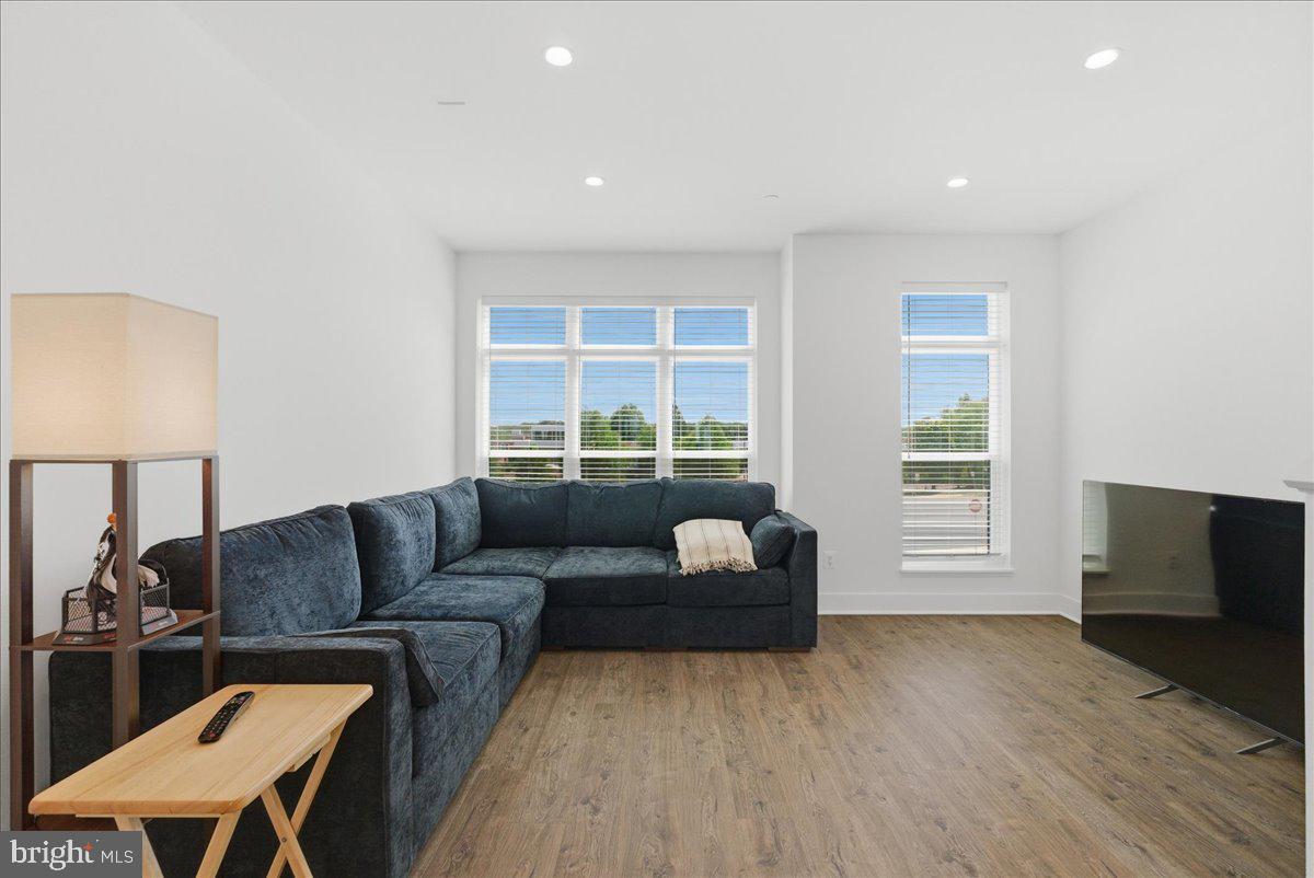 2018 Tysons Ridgeline Road Falls Church, VA 22043 - Photo 32 of 35 a living room with furniture and a flat screen tv