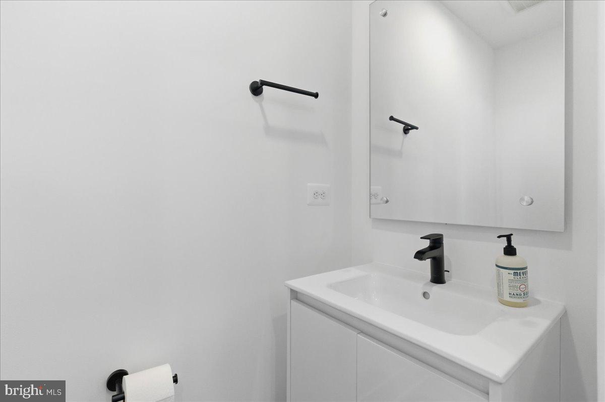 2018 Tysons Ridgeline Road Falls Church, VA 22043 - Photo 9 of 35 a bathroom with a sink and mirror