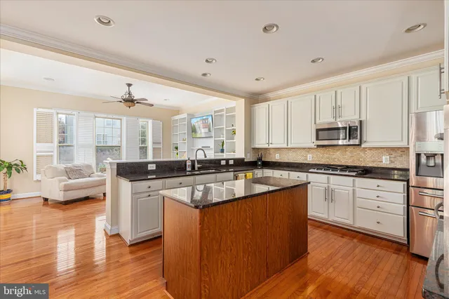a large kitchen with lots of counter space and a sink
