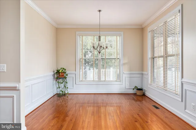 a kitchen with stainless steel appliances granite countertop a stove and cabinets