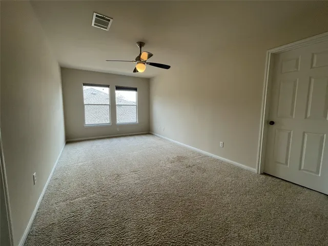 a view of a big room with carpet