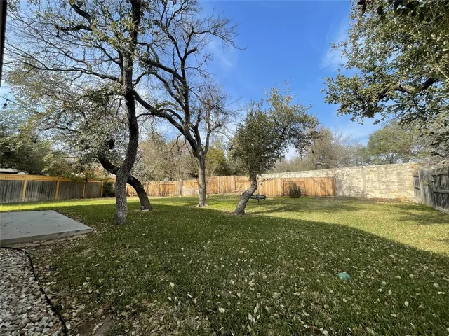 a house with swimming pool in front of it
