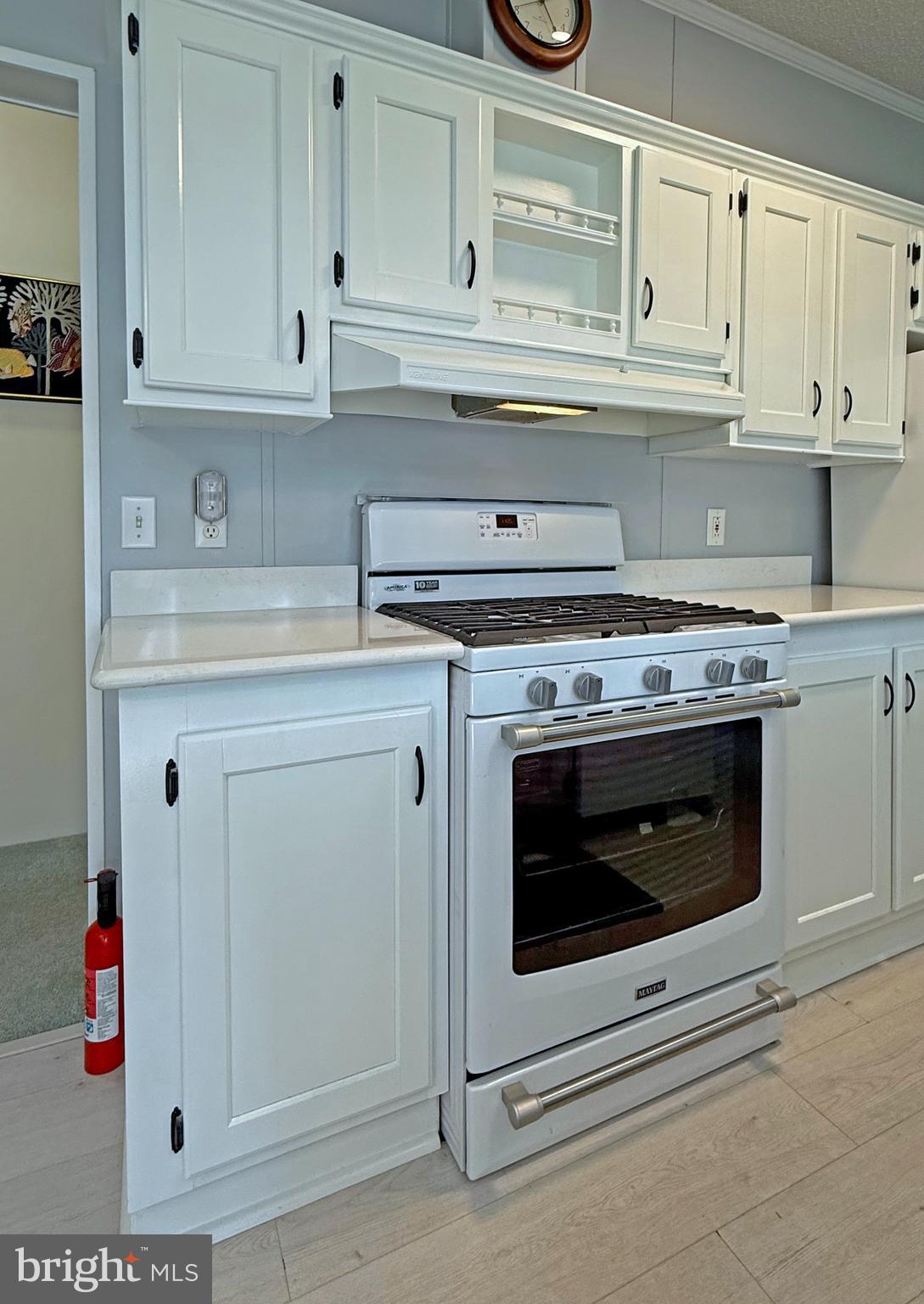 33280 Sassafras Court Ocean View, DE 19970 - Photo 15 of 45 a stove top oven sitting inside of a kitchen