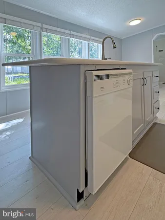 a view of a hallway with washer and dryer