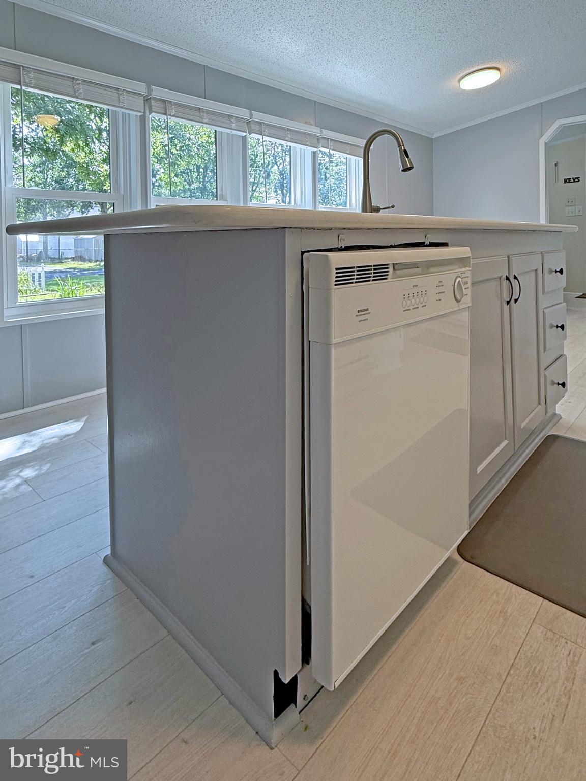 33280 Sassafras Court Ocean View, DE 19970 - Photo 17 of 45 a view of a hallway with washer and dryer