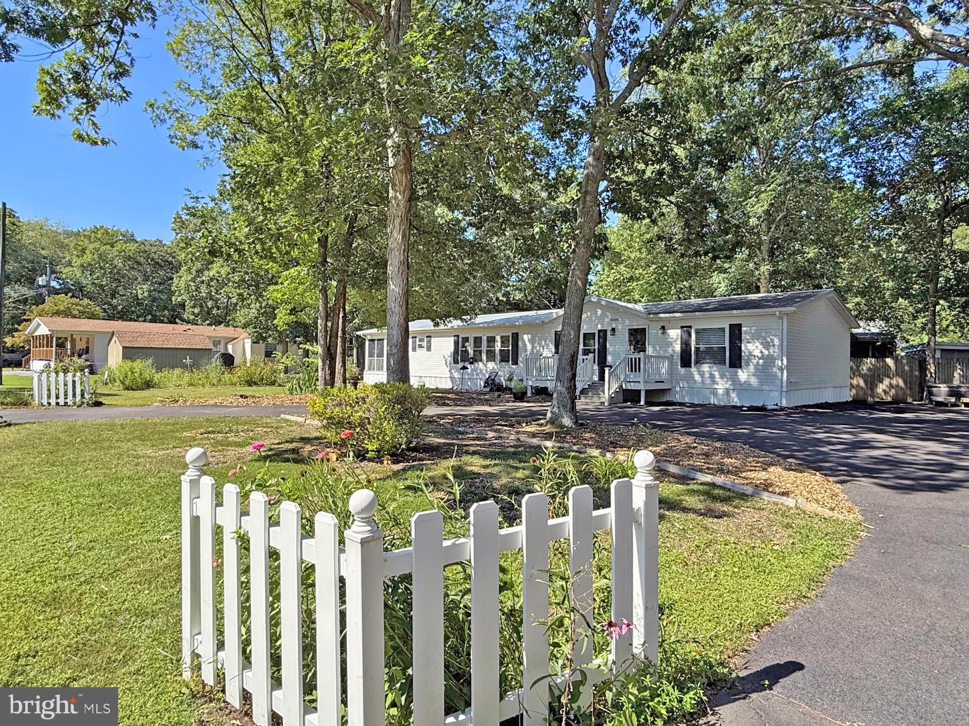 33280 Sassafras Court Ocean View, DE 19970 - Photo 2 of 45 a view of house with outdoor seating area