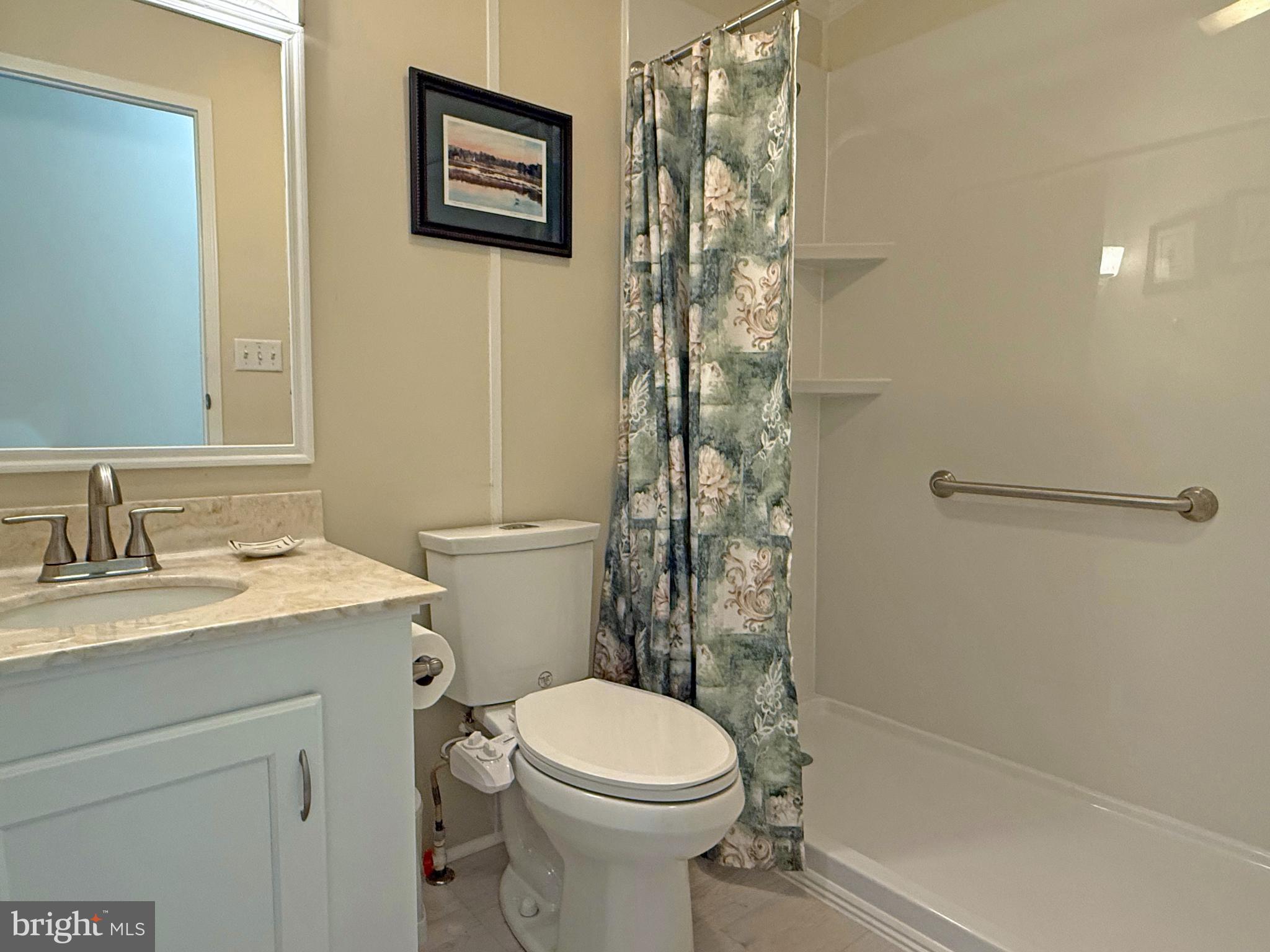 33280 Sassafras Court Ocean View, DE 19970 - Photo 28 of 45 a bathroom with a granite countertop toilet sink and shower