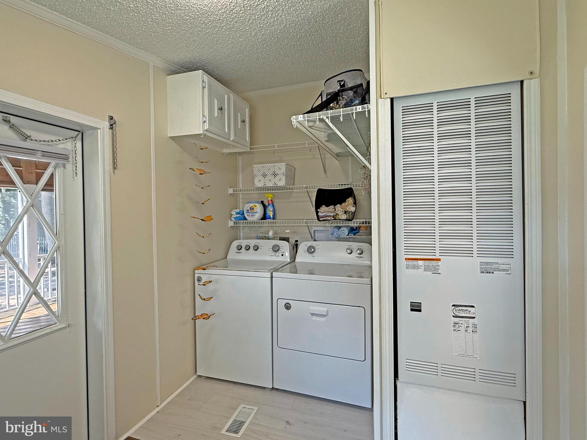 33280 Sassafras Court Ocean View, DE 19970 - Photo 29 of 45 a view of storage and utility room with washer and dryer