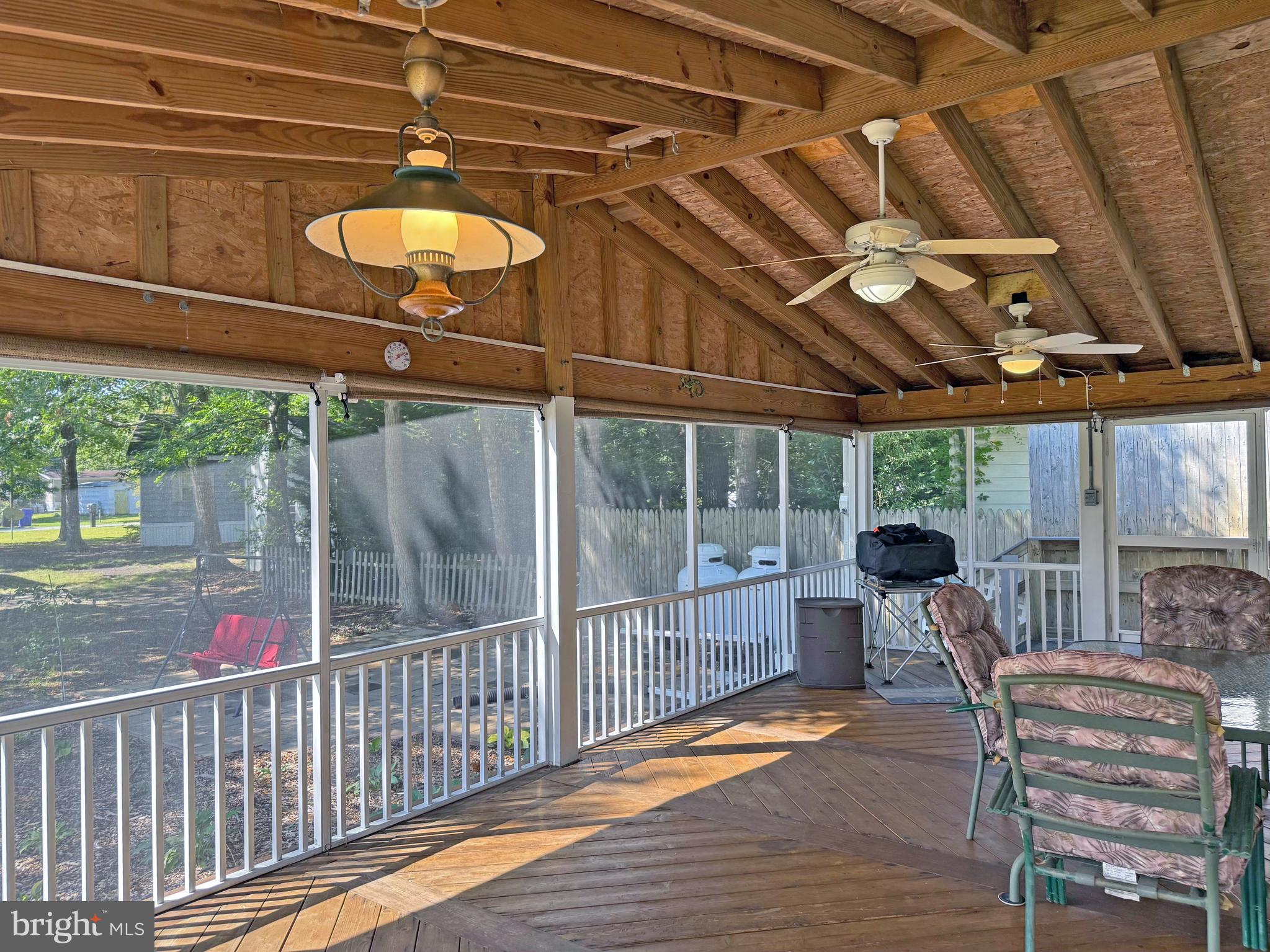 33280 Sassafras Court Ocean View, DE 19970 - Photo 32 of 45 a view of a chair and tables in the balcony