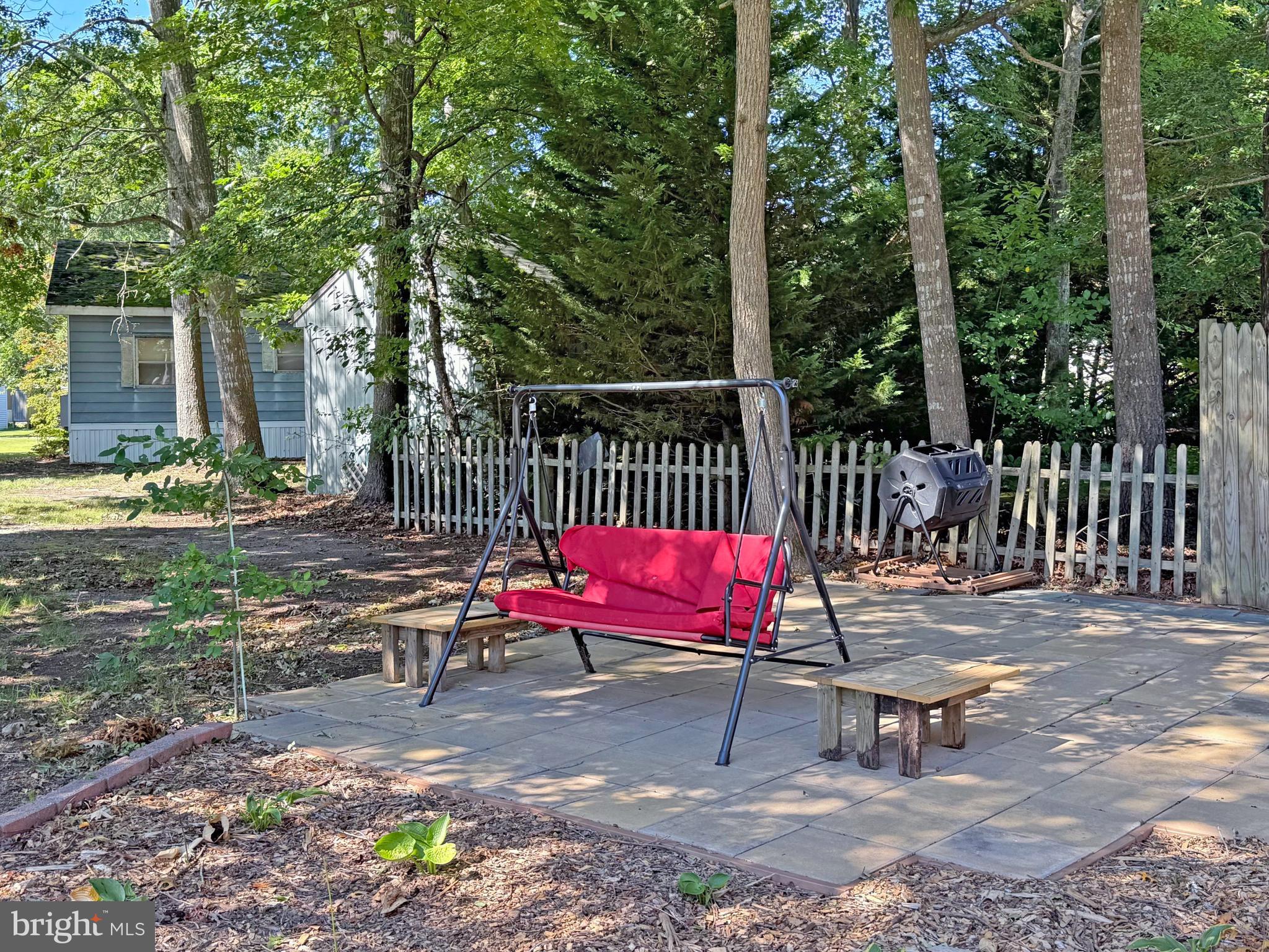 33280 Sassafras Court Ocean View, DE 19970 - Photo 34 of 45 a view of chairs with a small yard